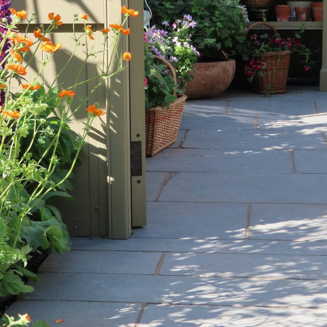 Tintagek Aged Slate paving leadinginto greenhouse.
